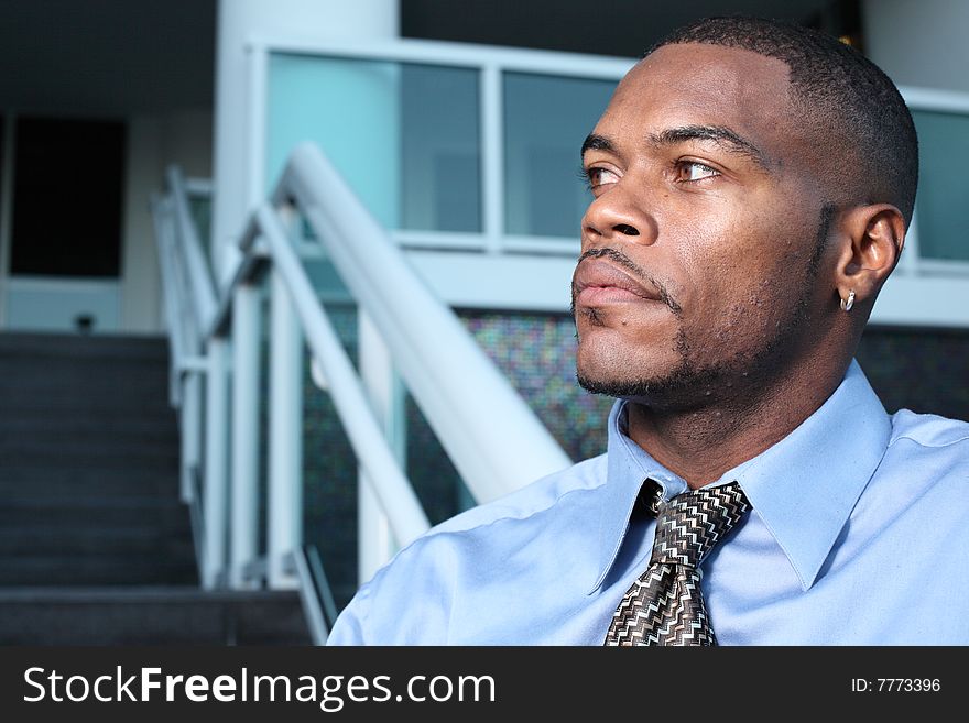 Profile headshot of a man looking away