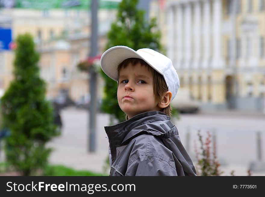 The offended grimace on the face of person of the four-year boy. The offended grimace on the face of person of the four-year boy