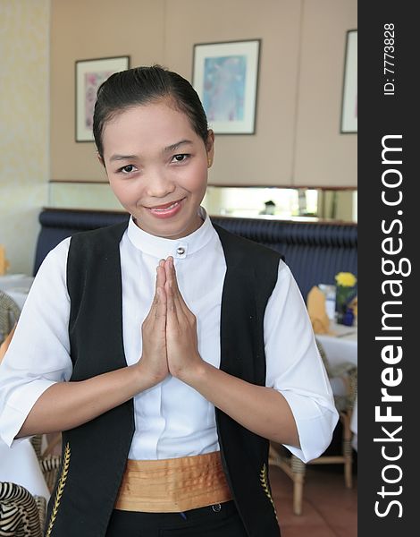 Asian waitress at work greeting