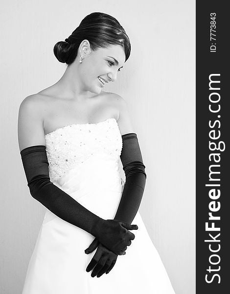 Beautiful Bride in a white dress with fancy gloves. Beautiful Bride in a white dress with fancy gloves