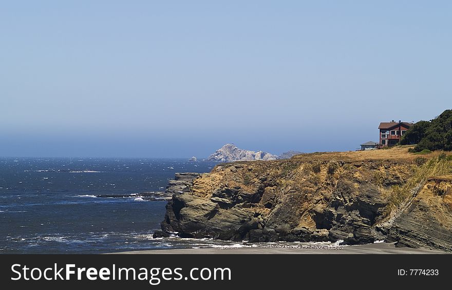 House on bluff over looking the pacific ocean. House on bluff over looking the pacific ocean