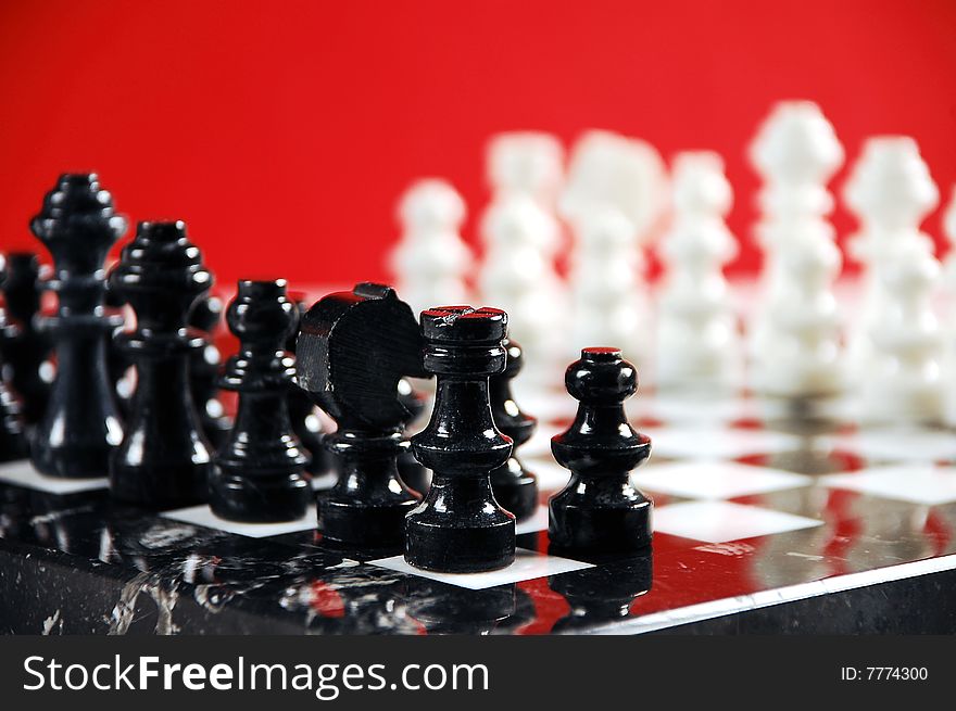 Black and white chessboard on red background