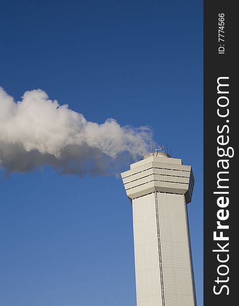 Large cloud of steam coming from a stack. Large cloud of steam coming from a stack