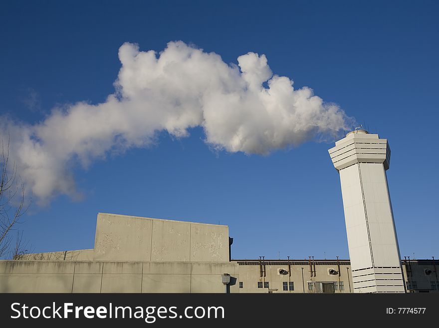 Large cloud of steam coming from a stack. Large cloud of steam coming from a stack