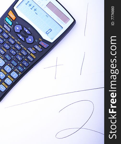Closeup of the calculator on the paper