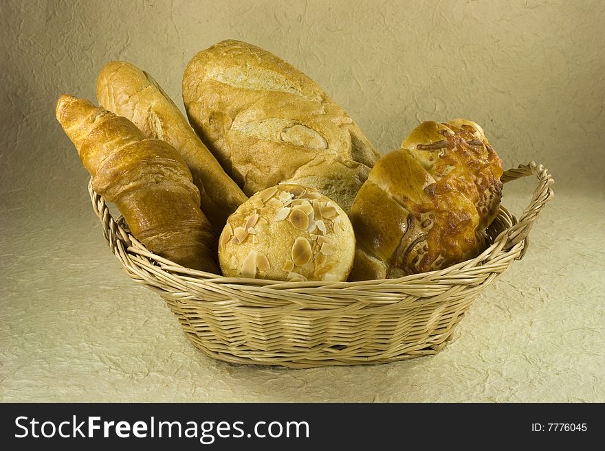 Different kids of bread in Basket. Different kids of bread in Basket