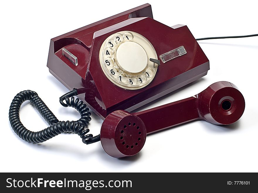 Old telephone on white isolated