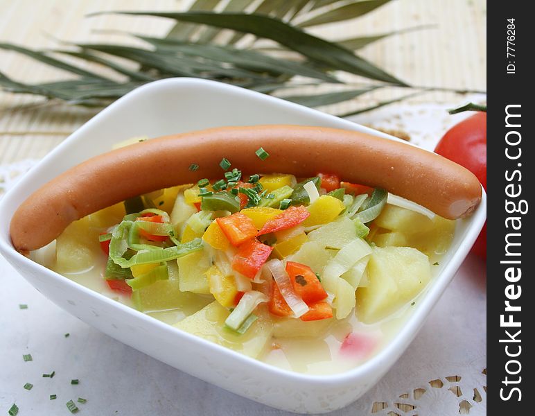 A fresh soup of potatoes with sausages