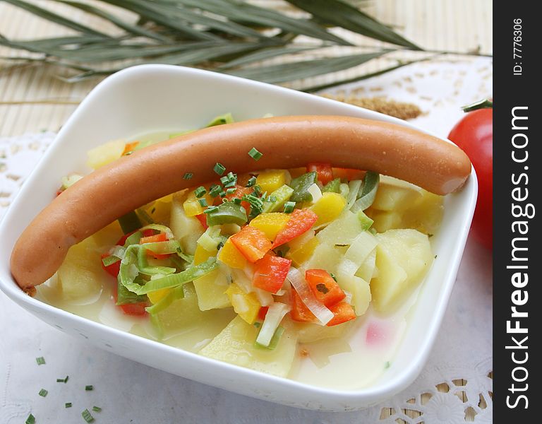 A fresh soup of potatoes with sausages