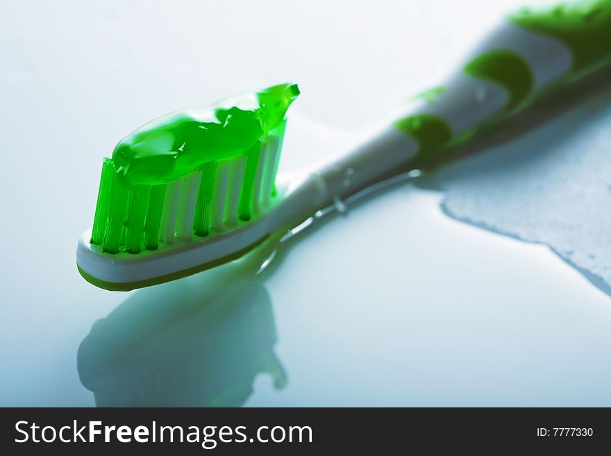 Wet toothbrush with green paste