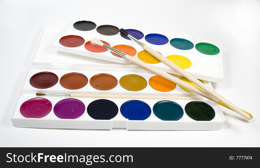 Set of water colour paints with paintbrushs