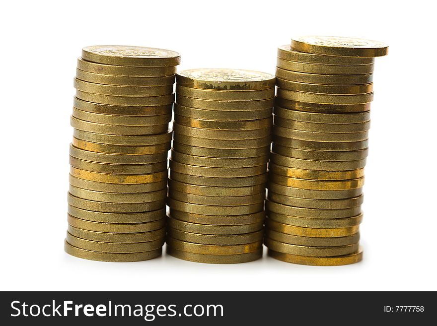 Three stacks of golden coins isolated on white