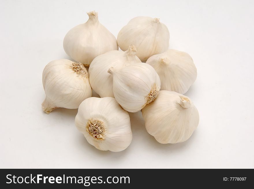 Several garlics on grey background