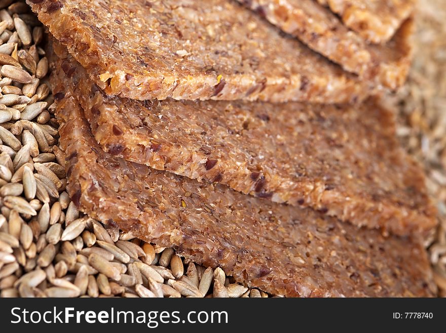 Close up of wholegrain bread and rye grains.