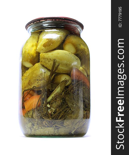 Glass jar with marinaded cucumbers isolated on white