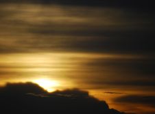Sunset Behind The Clouds Royalty Free Stock Photography