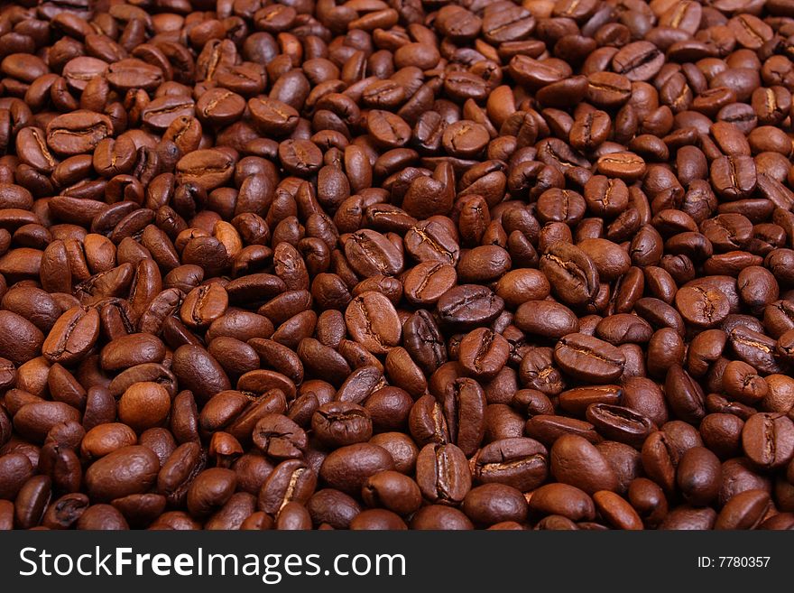Roasted coffee beans background in perspective. Roasted coffee beans background in perspective