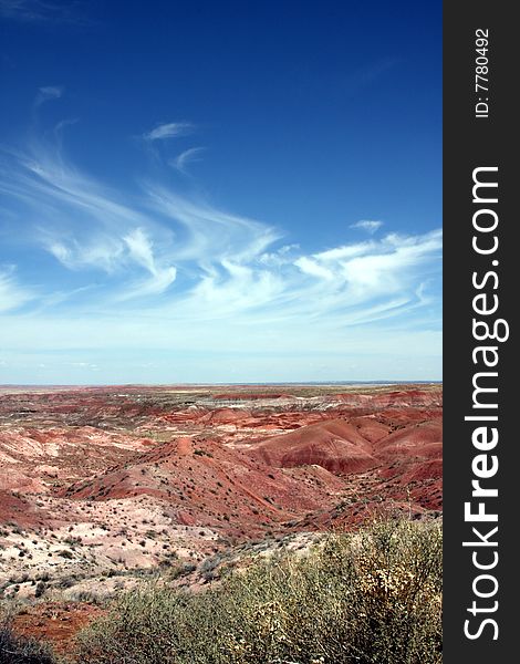 Painted desert in Arizona with wispy stratus clouds in  blue sky