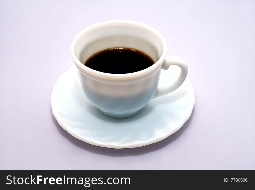 Black koffee, is white in cup. Isolated on blue background. Black koffee, is white in cup. Isolated on blue background.