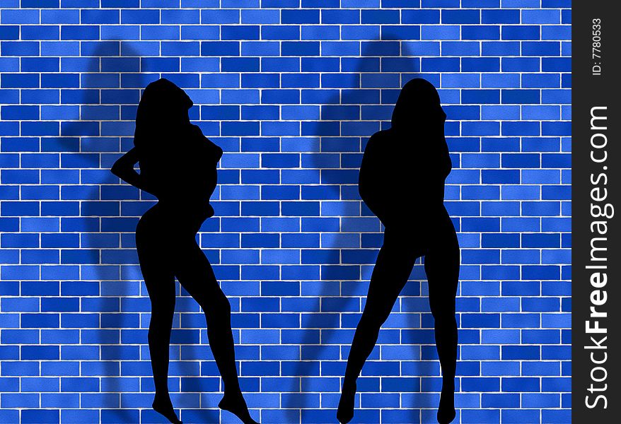 Two women in a sexy attitude against a brick background. Two women in a sexy attitude against a brick background