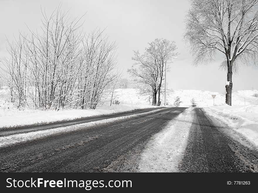 Winter road and a beautiful snowy landscape