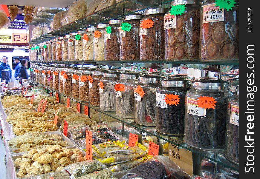 Chinatown market with rows of bottled good and fish bladders