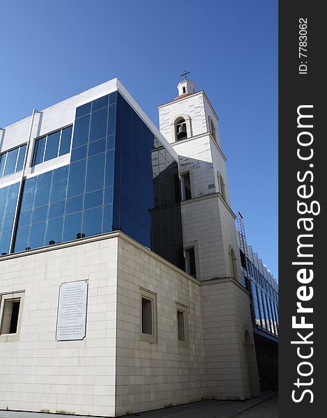 Bellfry on a glass windowed modern college