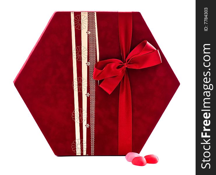 Gift box with candies over white