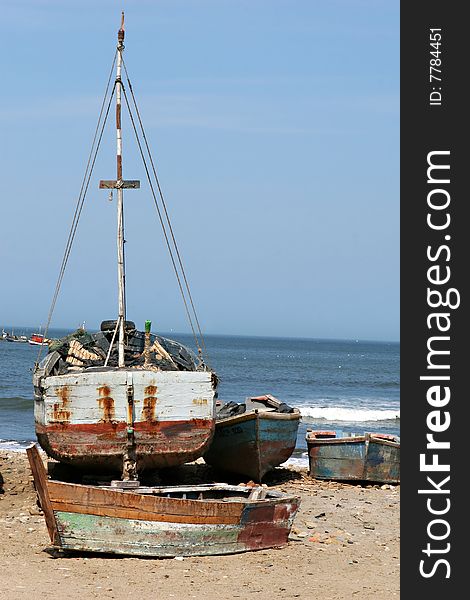 Old wooden fishing boats on the coast of Peru