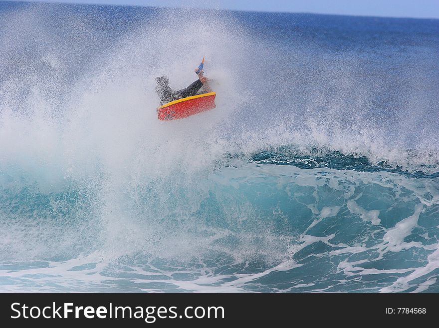 A bodyboarder catches air at the world famous Bonzai Pipline wave on the North Shore of Oahu Hawaii. A bodyboarder catches air at the world famous Bonzai Pipline wave on the North Shore of Oahu Hawaii.