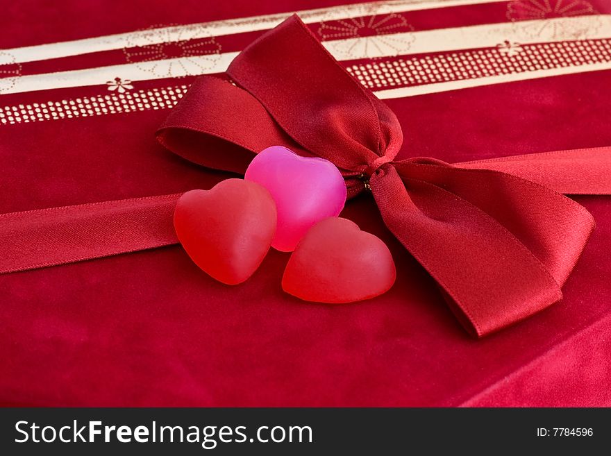 Hearts and bow over the red gift box