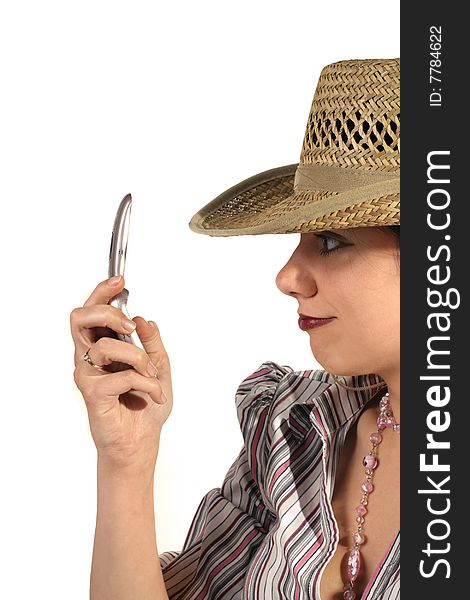 Young woman in cowboy hat with mobile phone. Young woman in cowboy hat with mobile phone