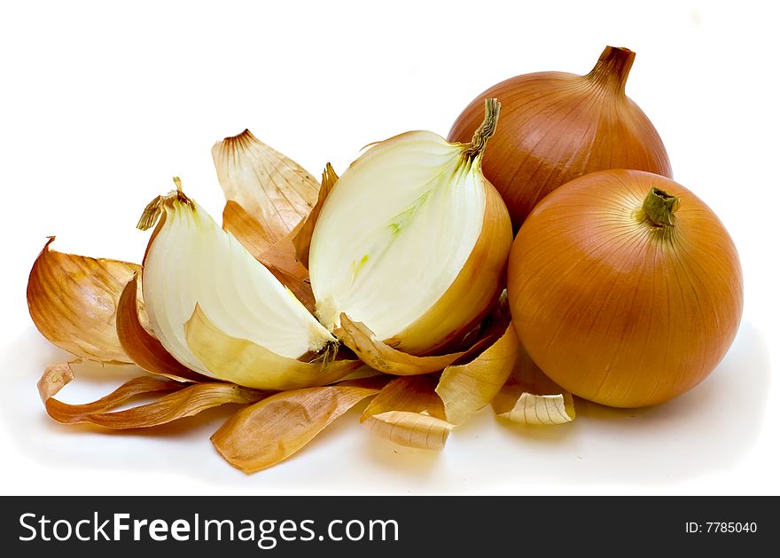Three large golden onions isolated on the white