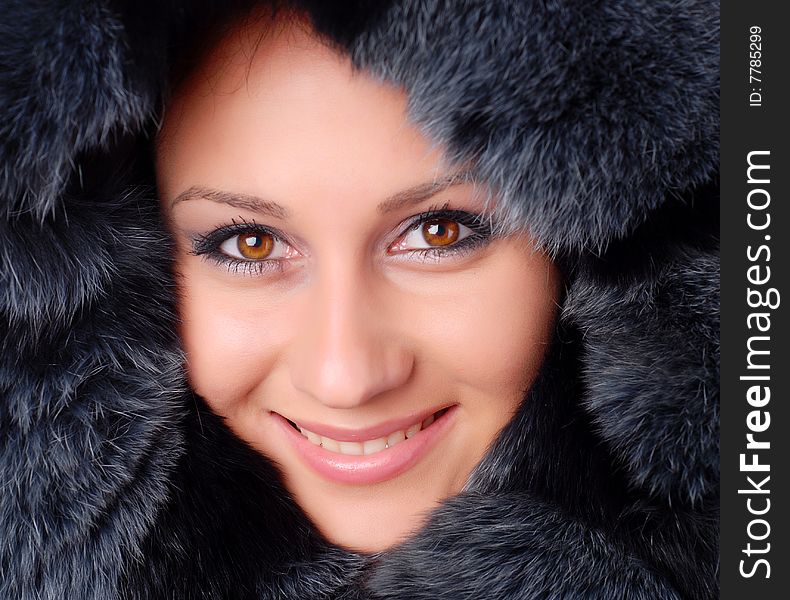 Face of a beautiful woman in black fur. Face of a beautiful woman in black fur