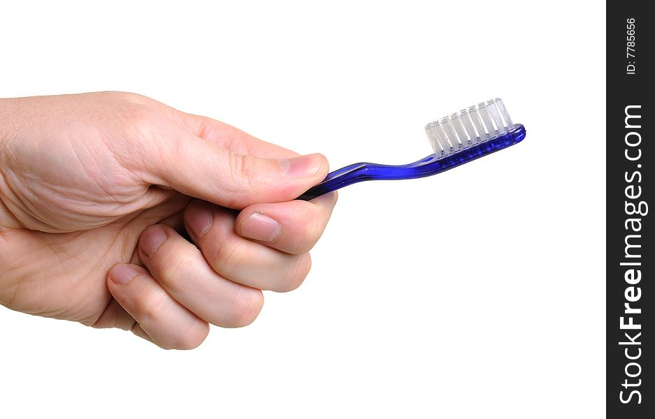 Hand holding blue toothbrush over white background. Hand holding blue toothbrush over white background