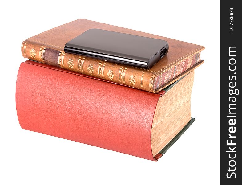 Old leather bound books with a computer hard drive isolated on a white background