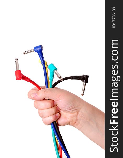 Hands with colored cables over white