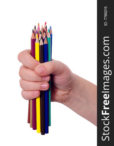 Thick colored pencils in a hand against a white background. Thick colored pencils in a hand against a white background