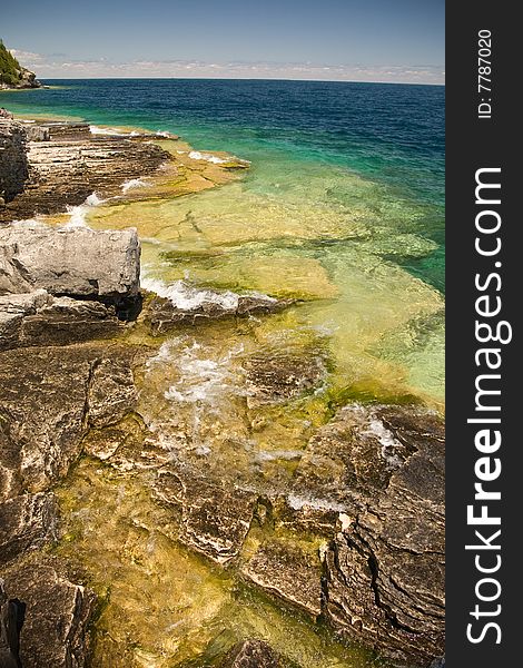 Open tropical water on rocky shelf beach. Open tropical water on rocky shelf beach.