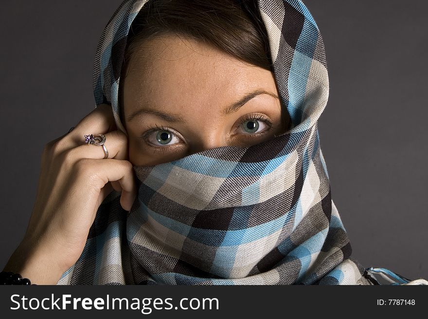 Portrait of young east woman with half closed face