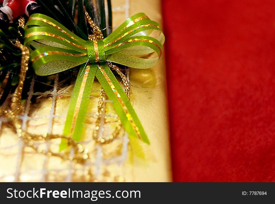 Gift box with bow over holiday lights background. Gift box with bow over holiday lights background