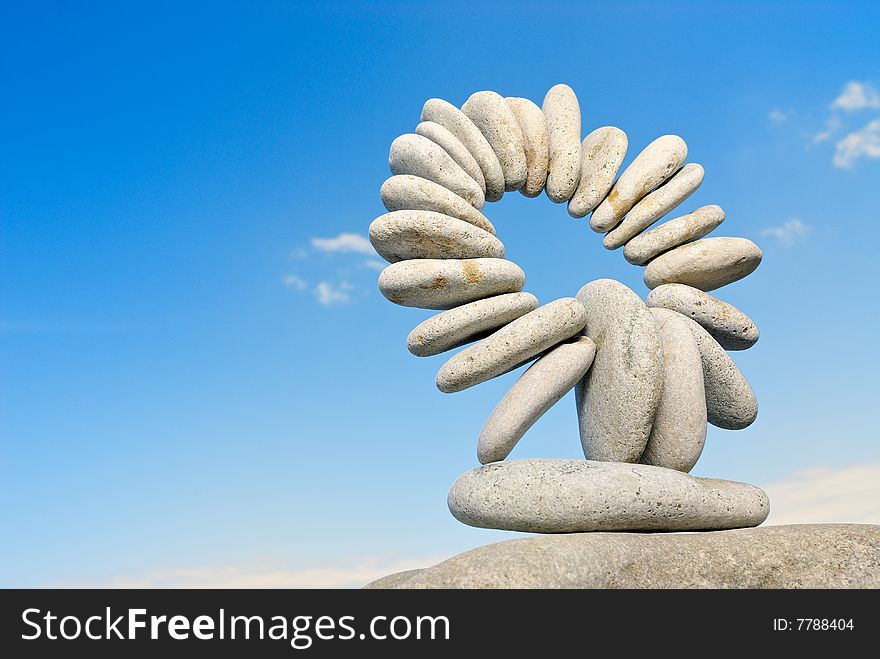 Pile of sea stones against the dark blue sky. Pile of sea stones against the dark blue sky