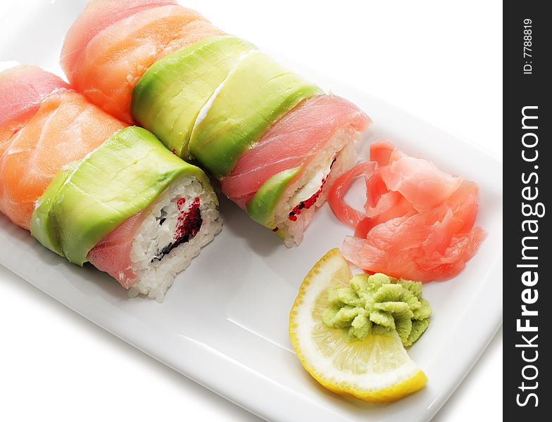 Salmon Roll on a Plate. Isolated on White Background. Salmon Roll on a Plate. Isolated on White Background