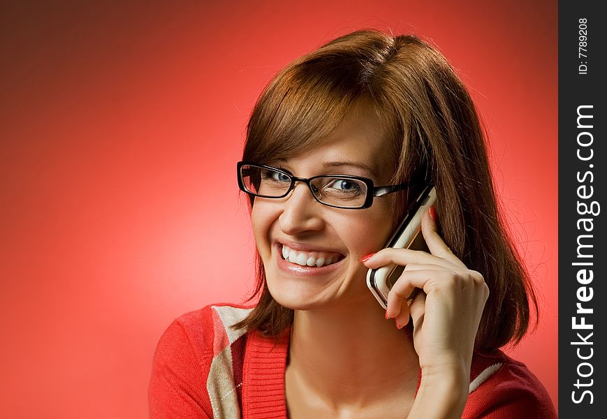 Beautiful smiling woman using a mobile phone