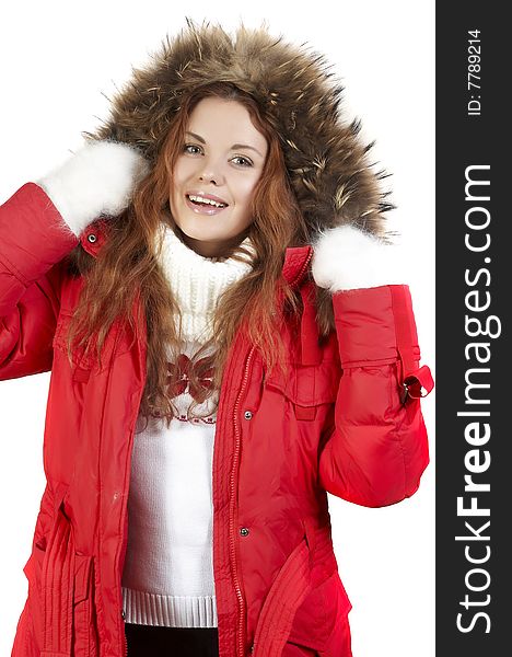 Portrait of the beautiful girl in a red winter jacket and fur collar. Portrait of the beautiful girl in a red winter jacket and fur collar