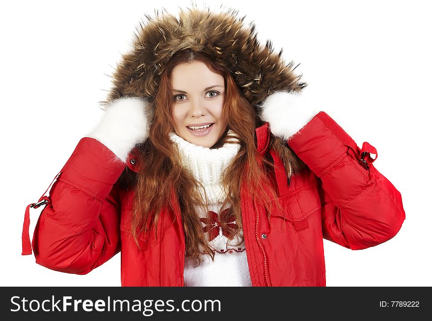 Portrait of the beautiful girl in a red winter jacket and fur collar. Portrait of the beautiful girl in a red winter jacket and fur collar