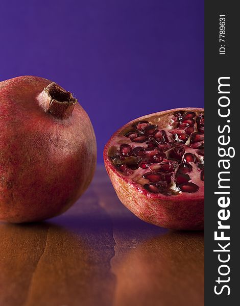 Fresh pomegranate halves, tropical fruit