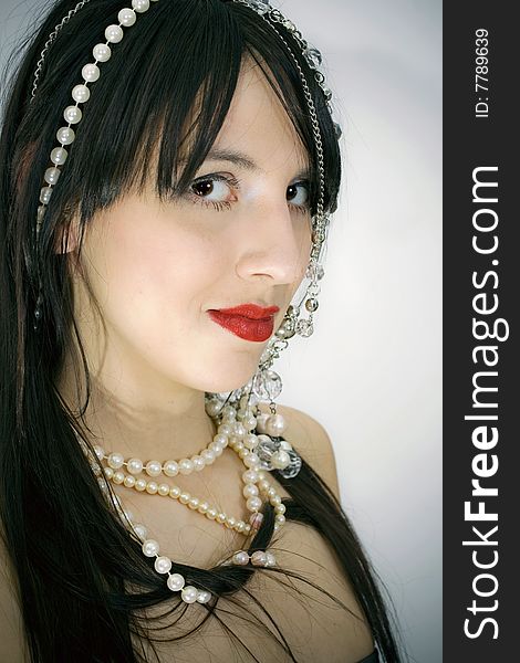 Beautiful girl with beads portrait photo