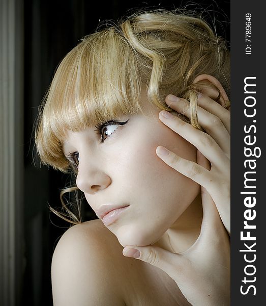 Young woman gazing out a window photo