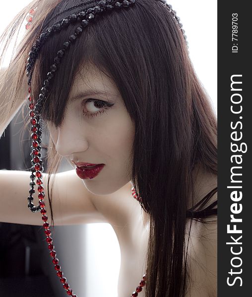 Beautiful girl with beads portrait photo